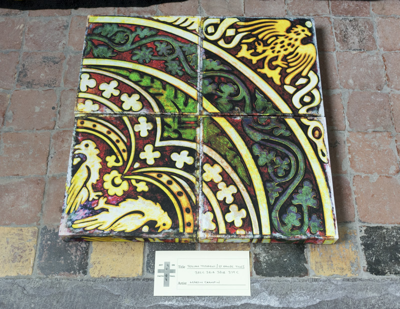 Four coloured patterned designs on the floor of the cathedral.